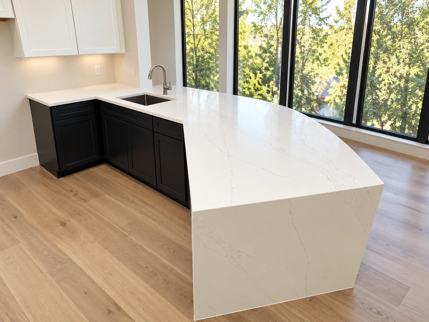 White veined waterfall peninsula beside floor-to-ceiling windows; retouched setting, stone color and veining preserved