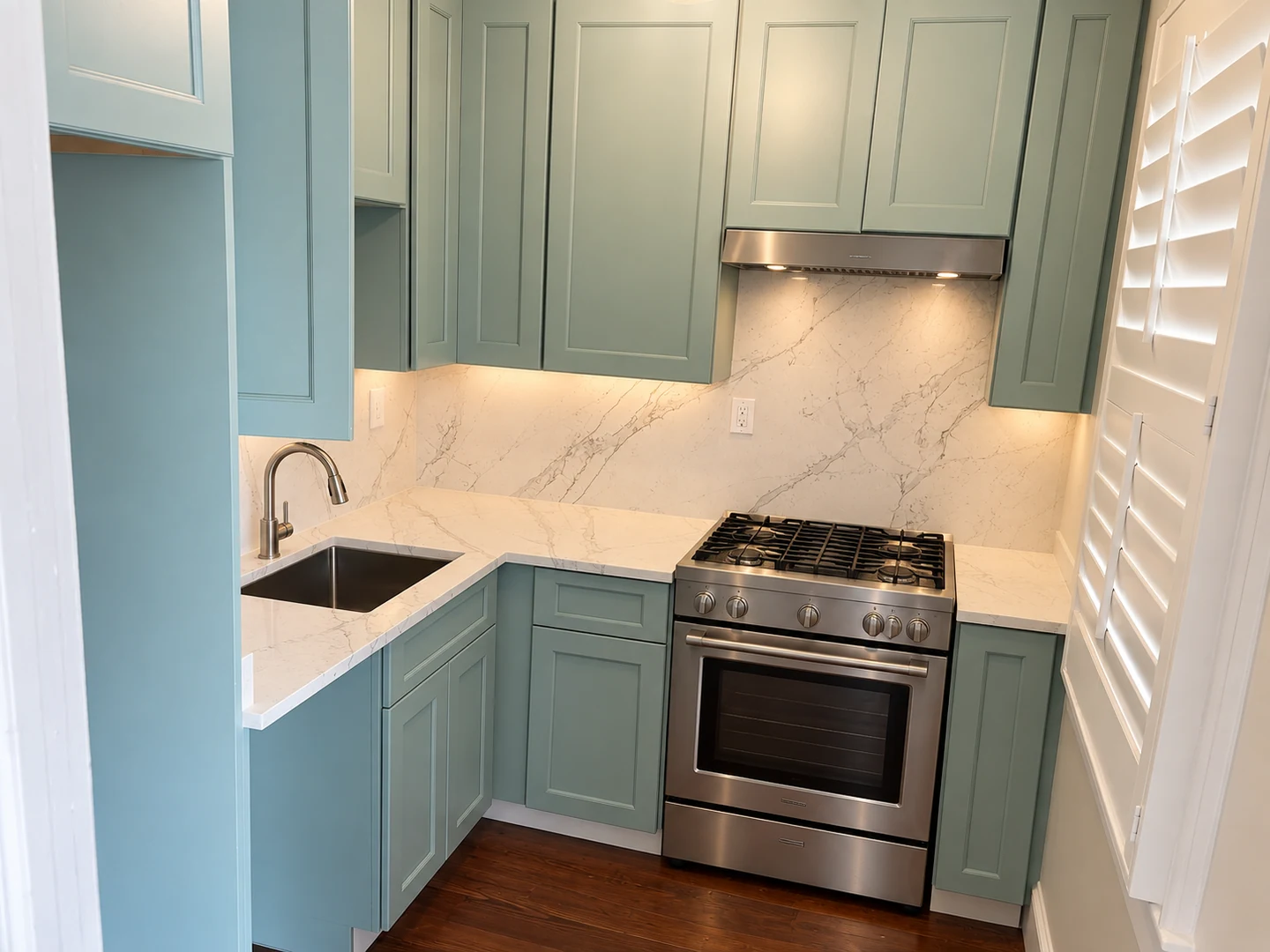 White veined counters and full backsplash with sage cabinetry; retouched setting, stone color and veining preserved